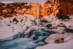 The sun rises on Thingvellir National Park in midwinter in Iceland.