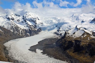 A glacier tongue stretches into the valley.